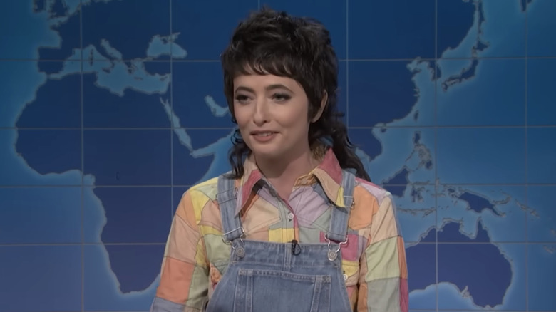 Sarah Sherman as herself smiling during Weekend Update on SNL