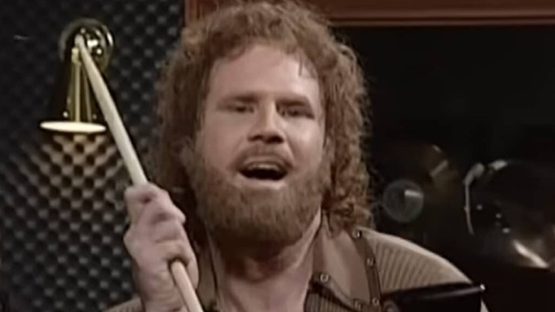Will Ferrell playing the cowbell and smiling on SNL