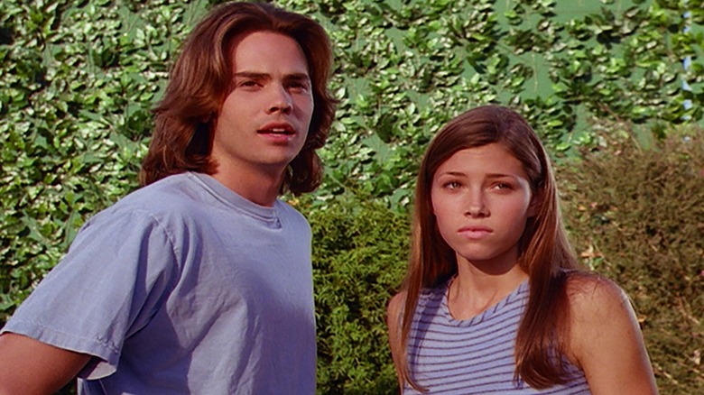 Mary Camden standing next to a boy with long hair in "7th Heaven"