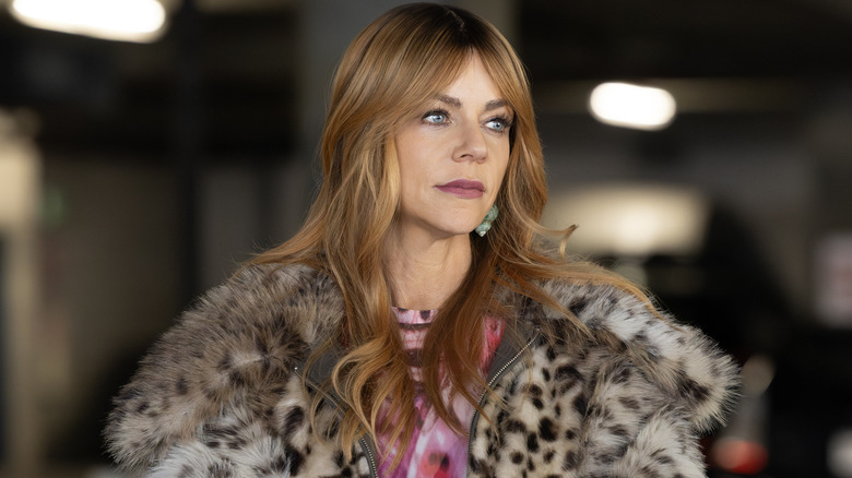 Morgan Gillroy in a leopard print fur jacket in "High Potential" (2024)