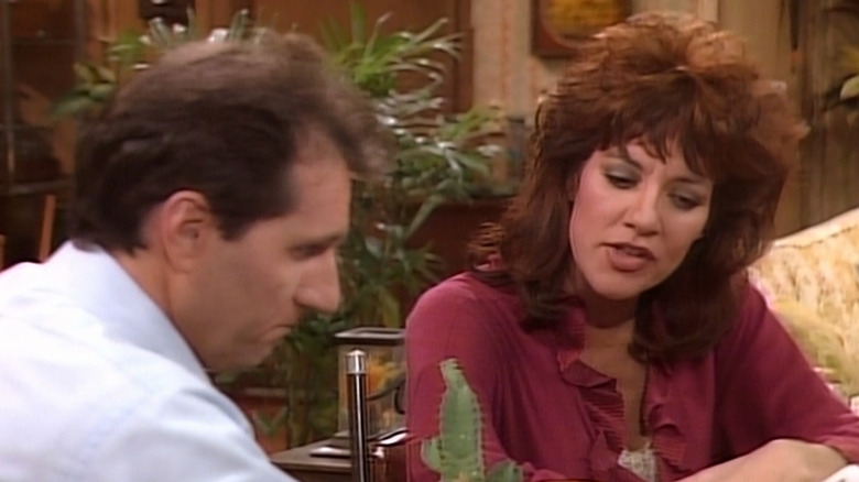 Al and Peg Bundy talking on couch