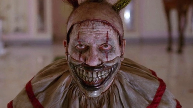 Twisty the Clown wearing his mask in "American Horror Story: Freak Show"