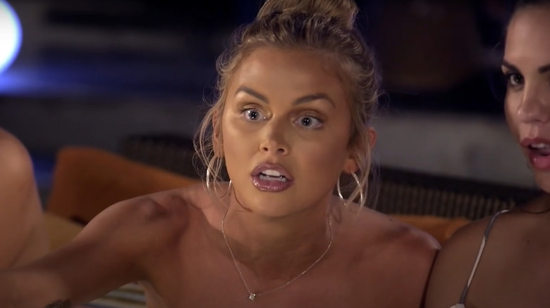 Lala Kent looking at someone with shock and anger while Katie Maloney watches with her jaw open next to her on Vanderpump Rules