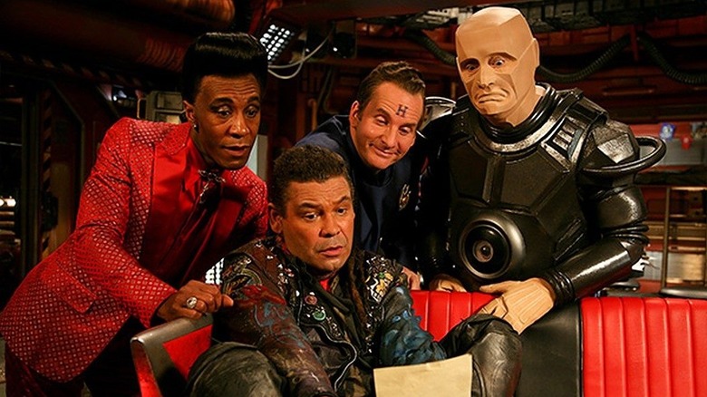 The Cat, Lister, Arnold Rimmer and the android Kryten gather aboard the titular ship on Red Dwarf.