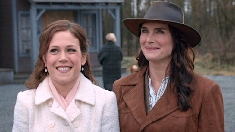 Elizabeth Thatcher and Charlotte Thornton standing next to each other and smiling in When Calls the Heart