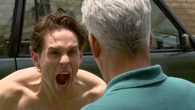 Glenn Howerton as Dennis, shirtless and screaming in his neighbor's face on It's Always Sunny in Philadelphia