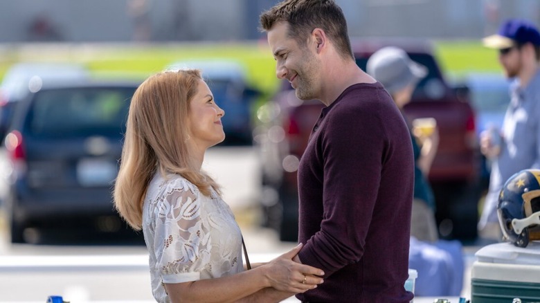 Aurora and Nick smiling at each other in "Reunited and It Feels So Deadly"