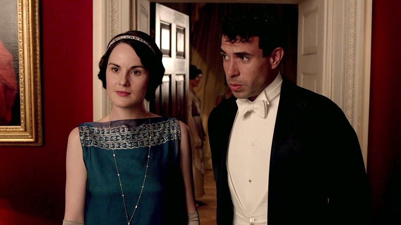 Mary Crawley and Anthony Gillingham standing next to each other in Downton Abbey
