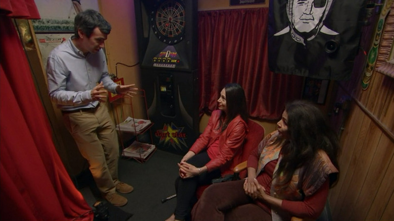 Nathan Fielder speaking to two women audience members in the Nathan For You episode "Smokers Allowed"