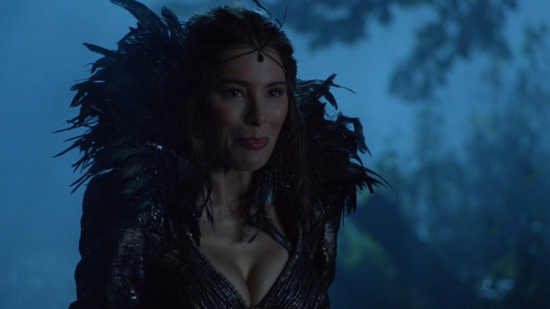 The Black Fairy standing under nightfall