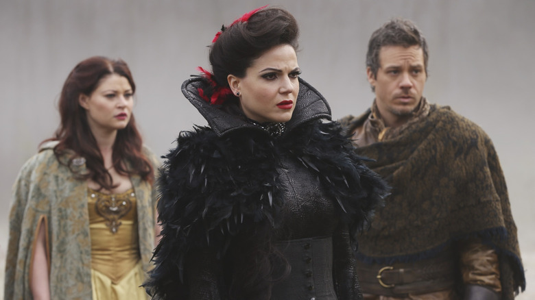 The Evil Queen standing in front of Belle and Baelfire in Once Upon a Time.