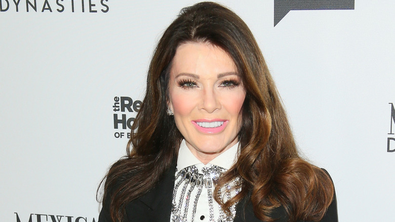 Lisa Vanderpump smiling on a red carpet at a Real Housewives of Beverly Hills event