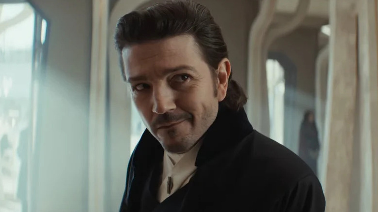 Cassian Andor smiling in a disguise in Andor season 2 (2025)