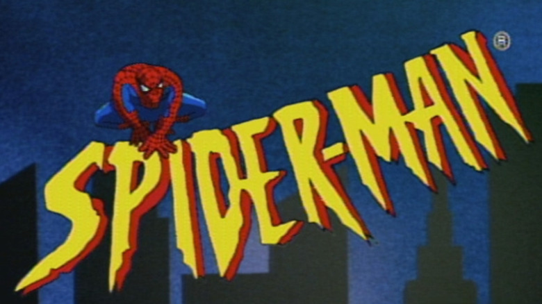 A yellow and red logo reading "Spider-Man" with a red and blue suited superhero with red lenses perched on top of the "P" and the "I"