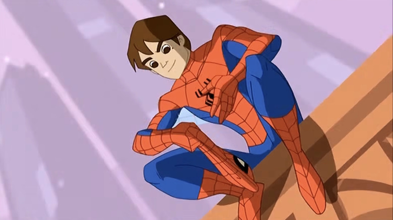 Spider-Man wearing a red and blue costume with a spider design on his chest, no mask, and shaggy brown hair.