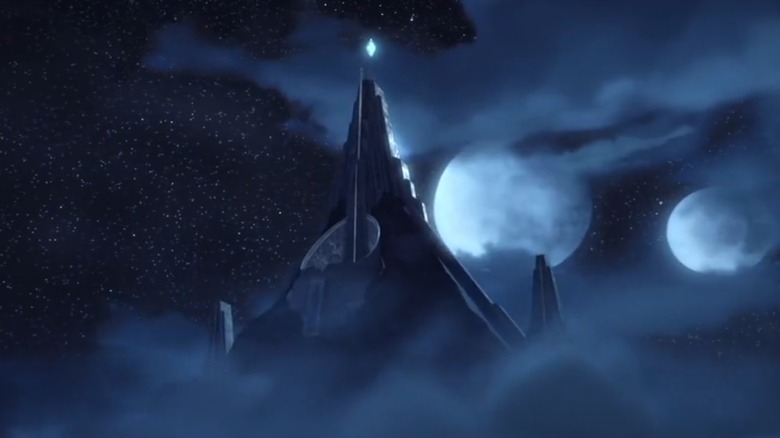 The monastery on Mortis, crowned by a shining crystal, peers through the clouds at night on Star Wars: The Clone Wars.