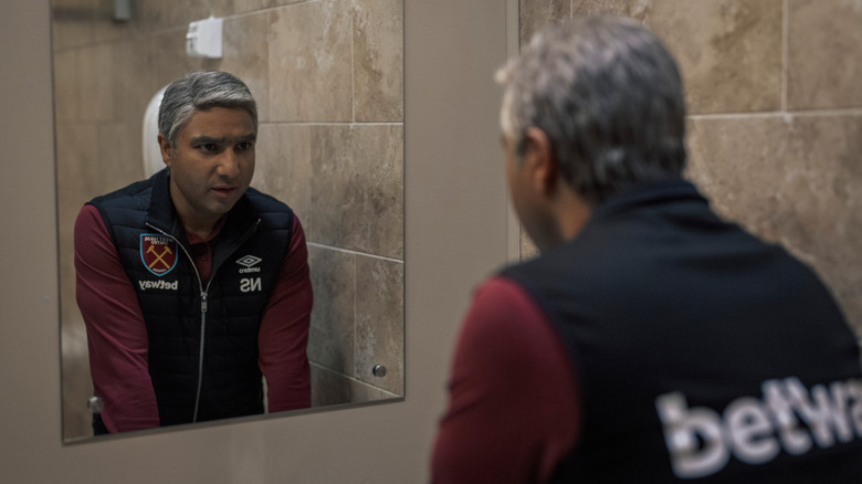 Nate Shelley giving himself a pep talk in a bathroom mirror