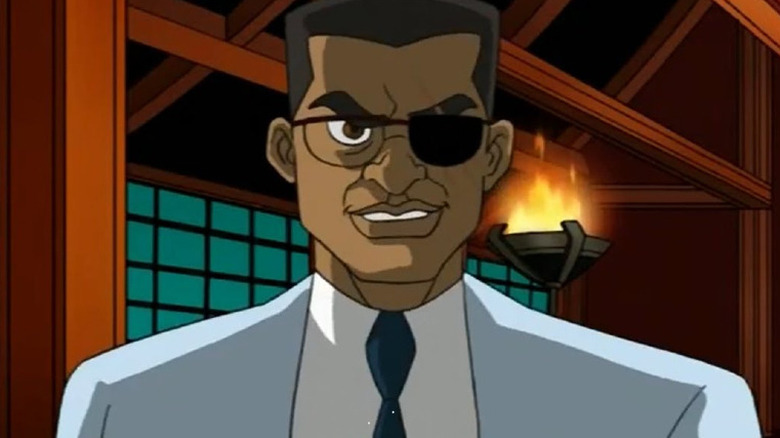 Baxter Stockman flashing an evil grin, an eyepatch over one eye, in Teenage Mutant Ninja Turtles (2003)