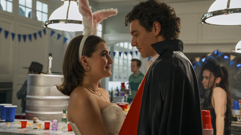 Hannah Wells (Ella Bright) wearing a bunny costume while standing in front of Garrett Graham (Belmont Cameli) in a magician costume in a scene from "Off Campus."
