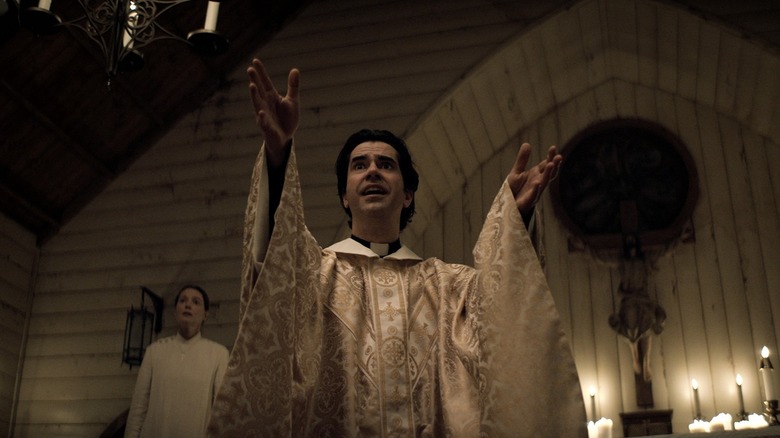 Father Hill performing a sermon