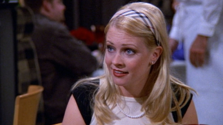 Sabrina at a table in a restaurant in "Sabrina the Teenage Witch" (1996)
