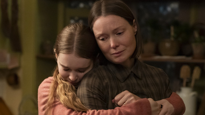 Summer H. Howell as Carrie hugging Samantha Sloyan as Margaret White in the series 'Carrie.'
