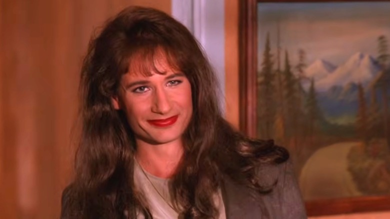 Denise Bryson smiles at the camera while wearing formal clothes in "Twin Peaks."