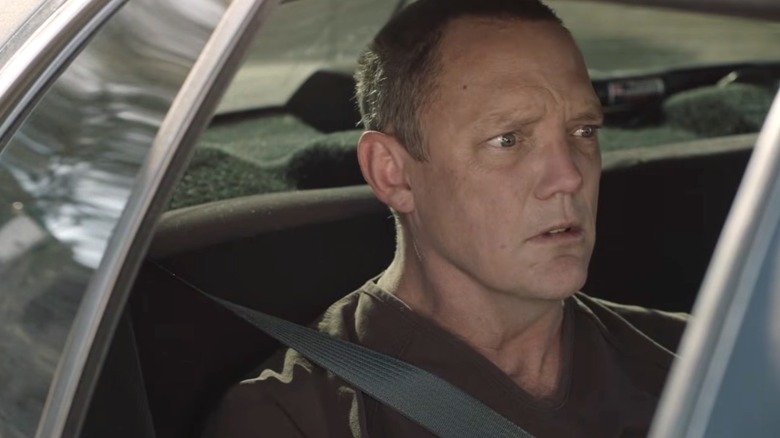 Bill Hastings sitting scared in a FBI car in "Twin Peaks."