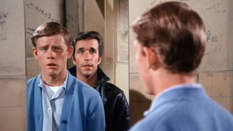 Richie and Fonzie looking in the mirror in "Happy Days."
