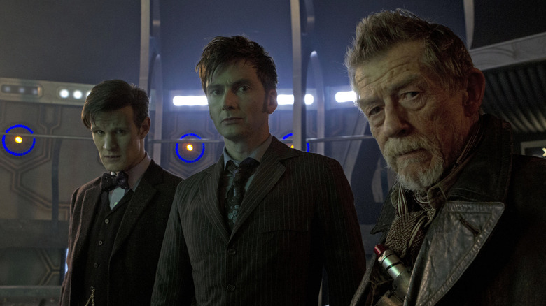 Three incarnations of the Doctor - played by Matt Smith, David Tennant and John Hurt - stand side by side on the Doctor Who 50th anniversary special.