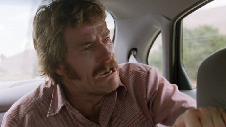 Patrick Crump looking distressed in the backseat of a car
