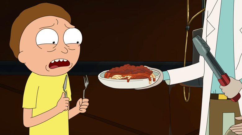 Morty being offered a plate of spaghetti made from people
