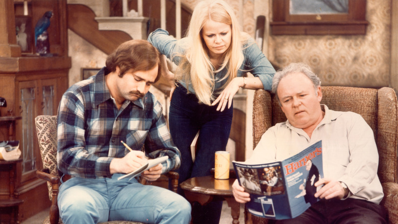 Characters Mike, Gloria, and Archie from All in the Family