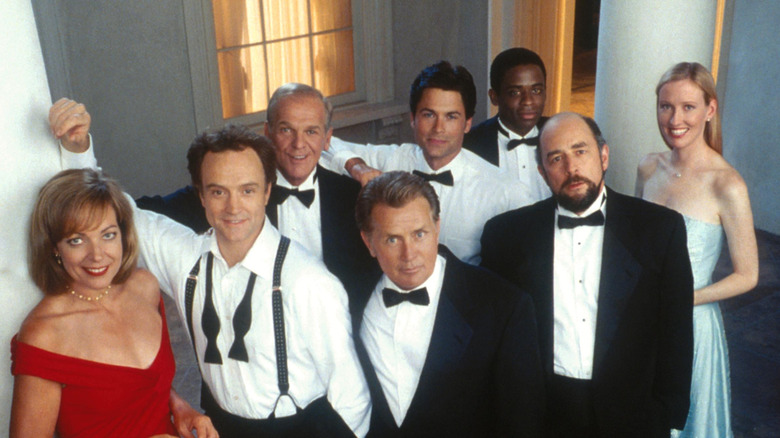 The cast of "The West Wing" posing together for the camera.