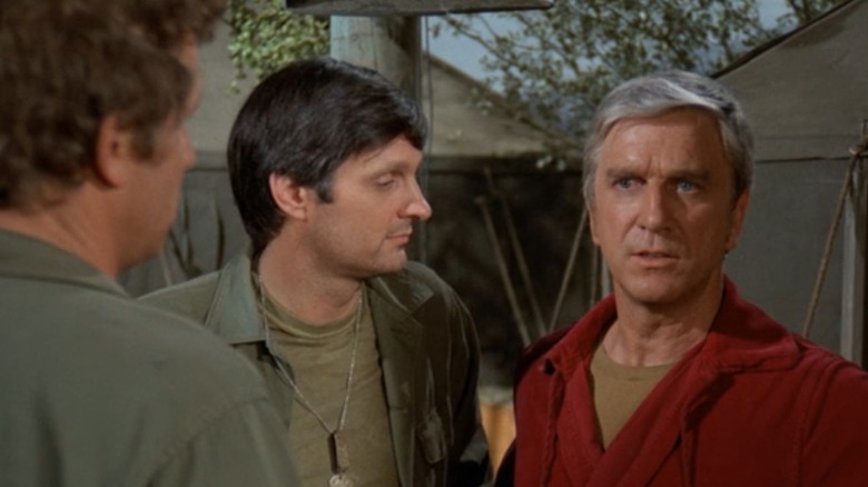 Leslie Nielsen appearing on an episode of M*A*S*H, speaking to Alan Alda