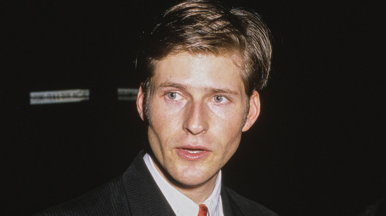 Crispin Glover walking and looking to the side