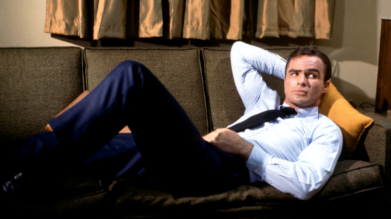 Detective Hawk lounges on a couch in "Hawk" (1966)