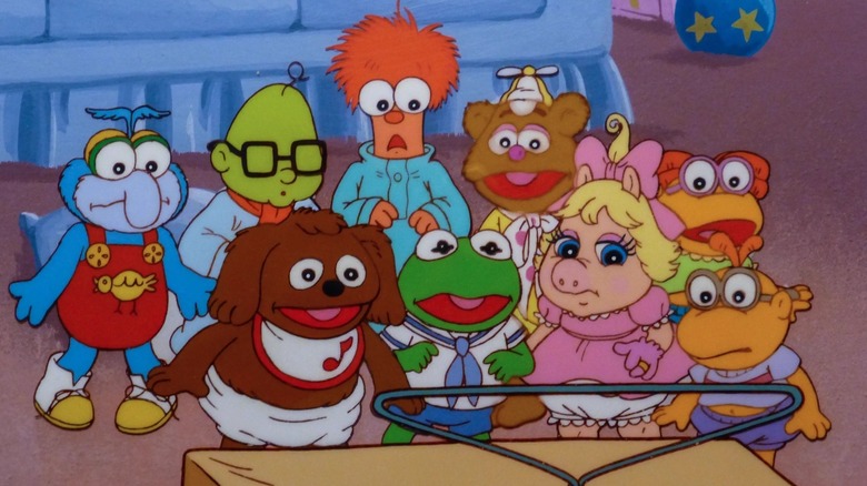 The Muppet Babies gathered around a television set