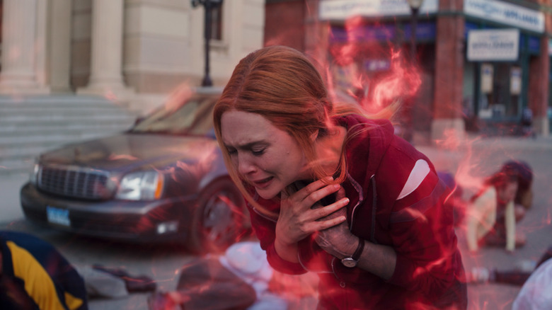 Wanda Maximoff doubles over, surrounded by chaos energy in "WandaVision" (2021)