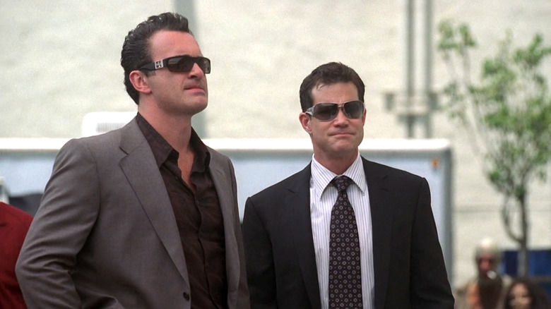 Nip/Tuck, Sean (Dylan Walsh) and Christian (Julian McMahon) wearing suits and sunglasses in Season 5 premiere