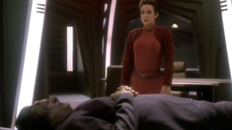Nana Visitor as Kira Nerys standing over Harris Yulin as a Cardassian on Star Trek: Deep Space Nine