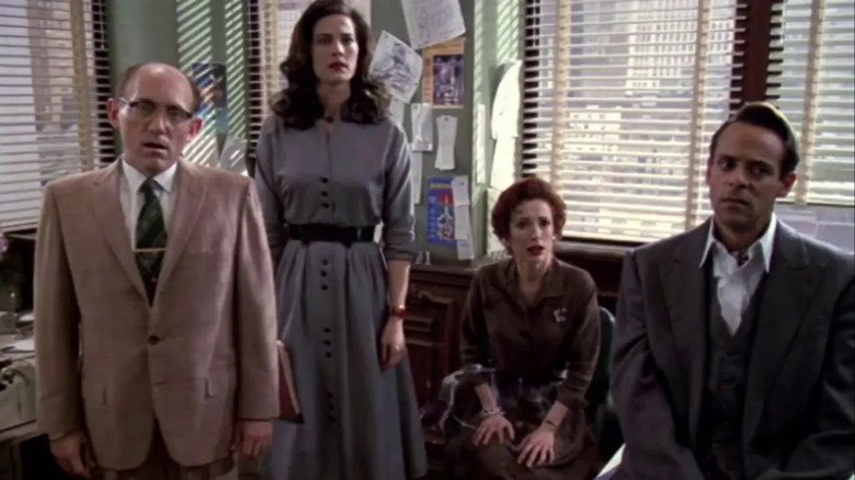 Armin Shimerman, Terry Farrell, Nana Visitor, and Alexander Siddig in an Earth office on Star Trek: Deep Space Nine