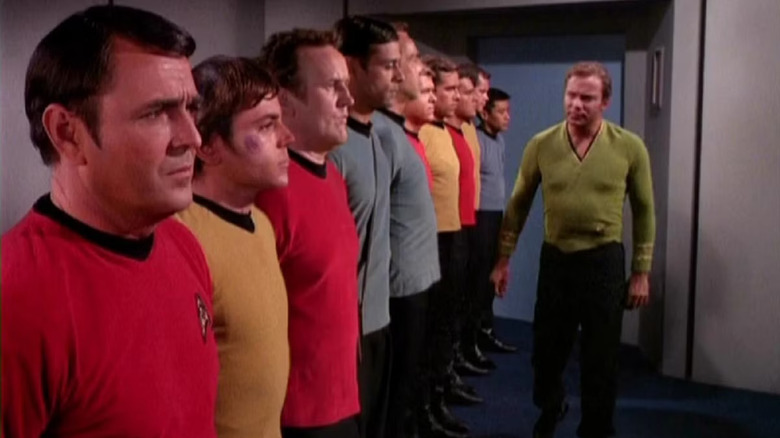 Captain Kirk looks over his crew, though Miles and Julian from Deep Space Nine are hiding out in old school uniforms on Star Trek: Deep Space Nine