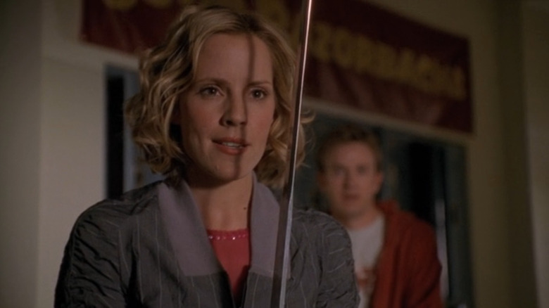 Anya smiling as she holds a sword in Buffy the Vampire Slayer Season 7 (2003)
