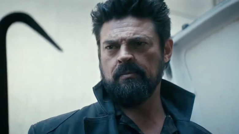 Billy Butcher (Karl Urban) looking at a hook on "The Boys."