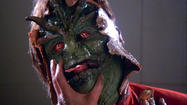 A Visitor reveals his reptilian face in V (1983)