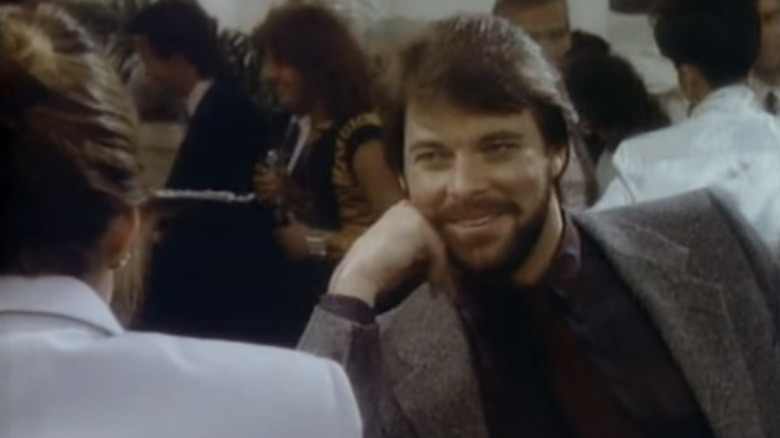 Jonathan Frakes as "Single Guy" talking to a woman at a bar in The Twilight Zone (1985)