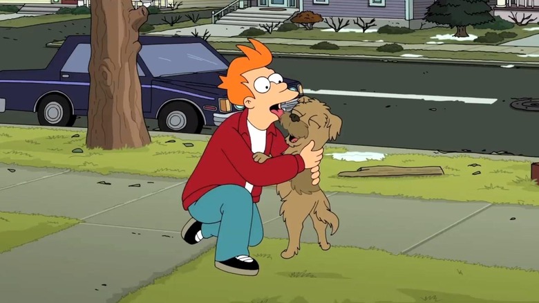 Fry licking his dog on the sidewalk on Futurama