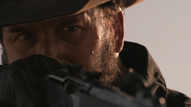 Rip Wheeler looking through the scope of a gun on Dutton Ranch