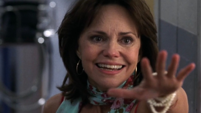 Sally Field as Maggie Wyczenski smiling and reaching her hand out on "ER"